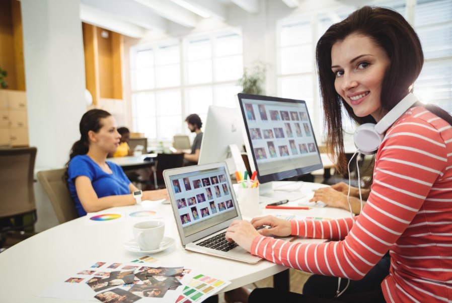 A designer working with her team in the Web Design Walla studio