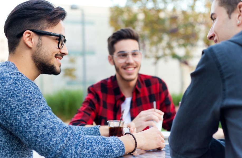 Colleagues sharing a laugh over coffee