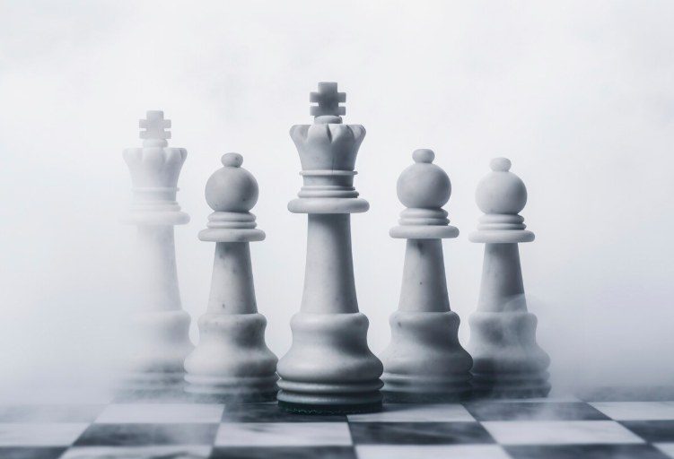 Chess king piece leading the board, representing strategy and leadership