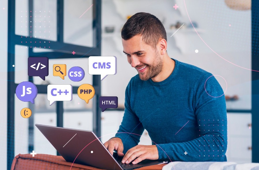 A developer coding, surrounded by icons for JS, CSS, PHP, HTML and CMS